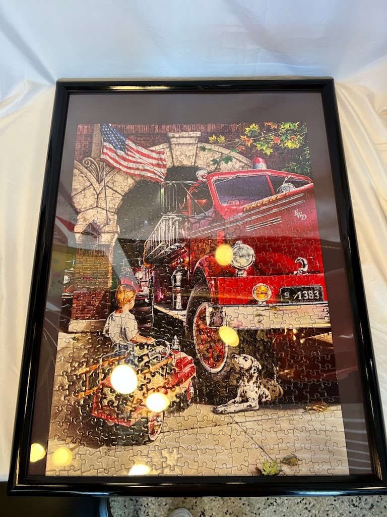 Black frame with puzzle fire truck dog boy