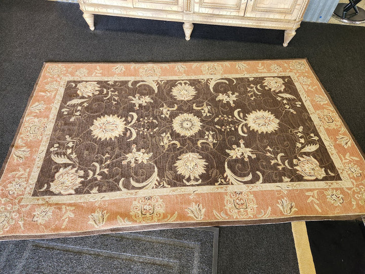 Brown and beige\pink floral area rug