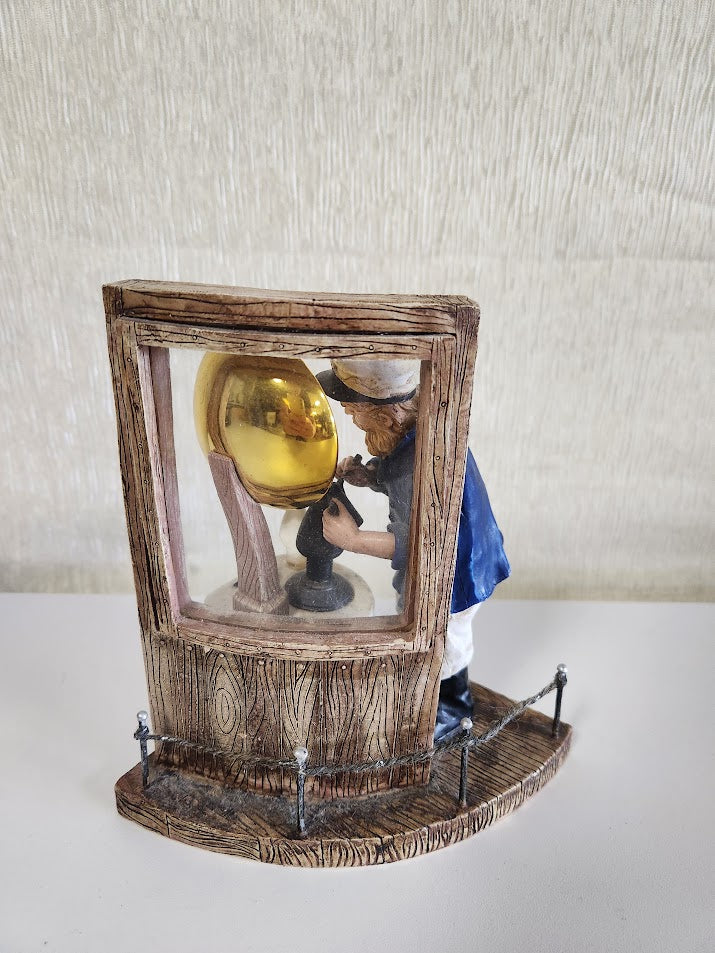 "Lighthouse Keeper Filing Oil Lamp" Statue