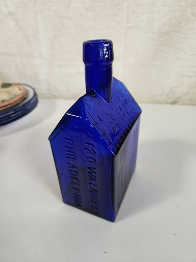 cobalt blue old cabin whiskey bottle 8"