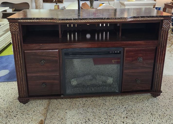 Ashley FurnitureDK Brown Console With Fireplace