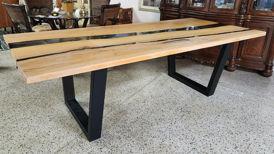 Live-edge wooden dining table w/black epoxy
