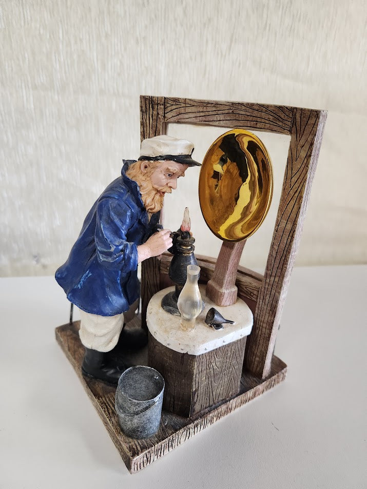 "Lighthouse Keeper Filing Oil Lamp" Statue