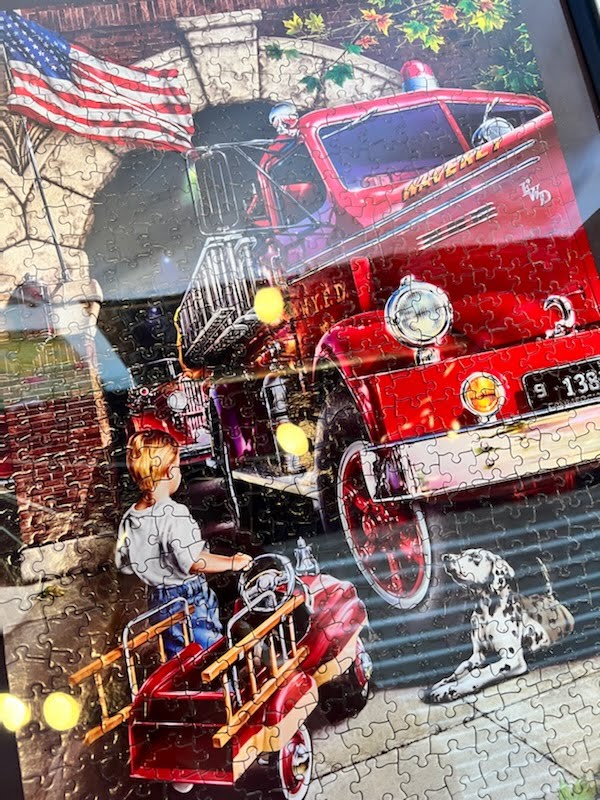 Black frame with puzzle fire truck dog boy