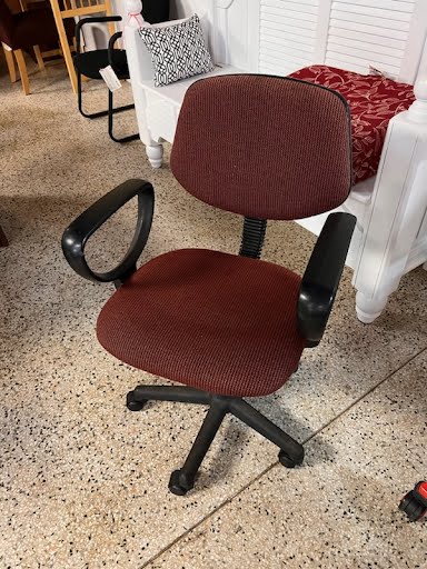 Burgundy office chair on casters