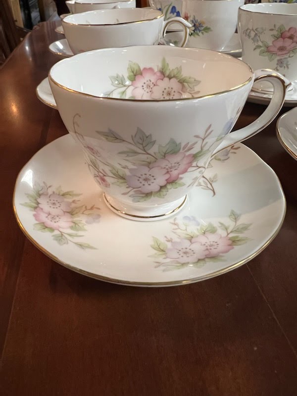 Tea cup and saucer, pink/purple flowers