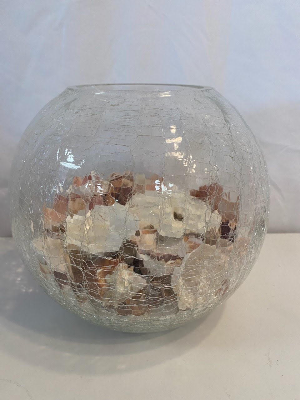 Crackle glass bubble vase with seashells