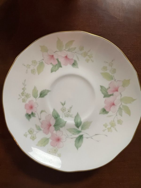 Tea cup and saucer, light pink flowers