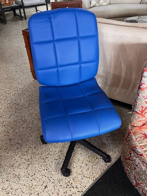 Blue quilted vinyl swivel office chair on casters
