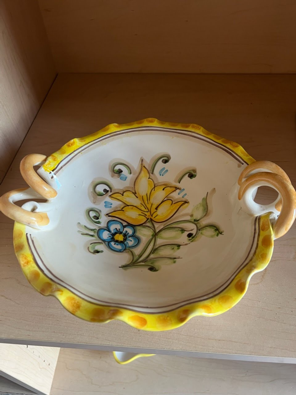 Yellow trim bowl with painted flower