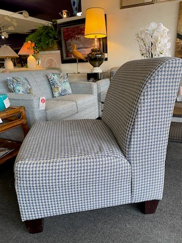 Armless upholstered blue houndstooth patterned chair