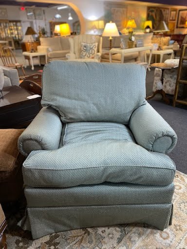 Blue skirted upholstered arm chair